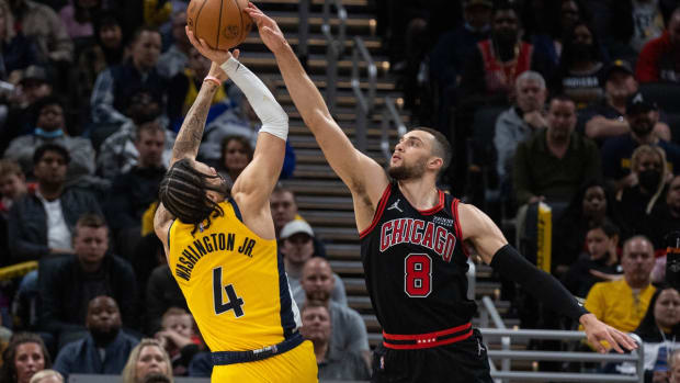 Dec 31, 2021; Indianapolis, Indiana, USA; Chicago Bulls guard Zach LaVine (8) blocks the shot of Indiana Pacers guard Duane Washington Jr. (4) in the second half at Gainbridge Fieldhouse. Mandatory Credit: Trevor Ruszkowski-USA TODAY Sports